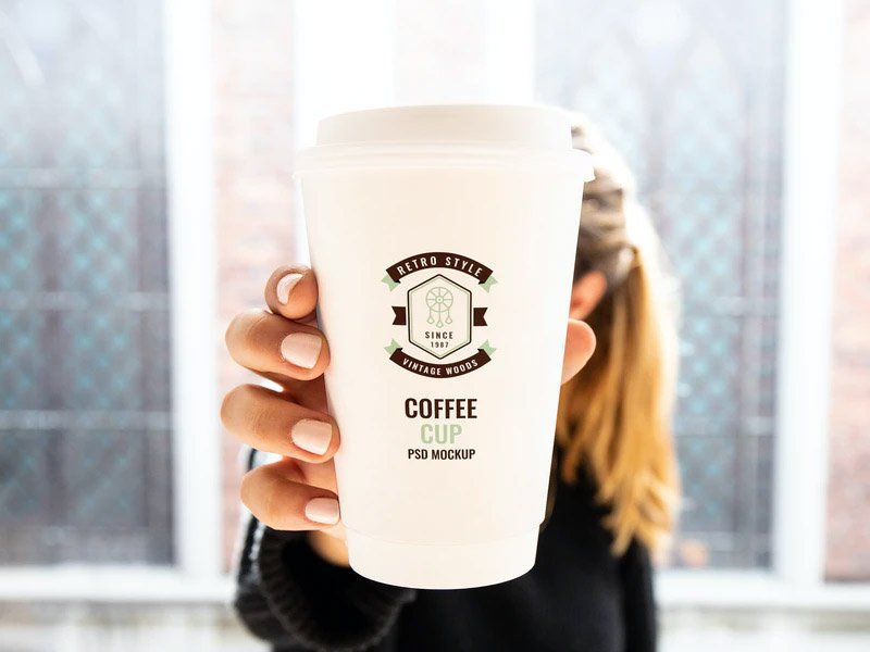 Paper Cup in Woman Hand - Free PSD Mockup