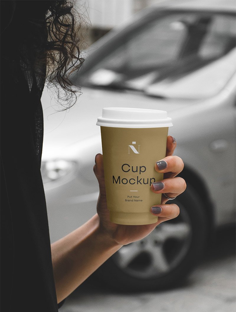 Woman Holding Disposable Cup - Free Mockup