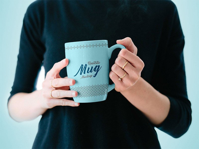 Mug in Woman's Hand - Free PSD Mockup